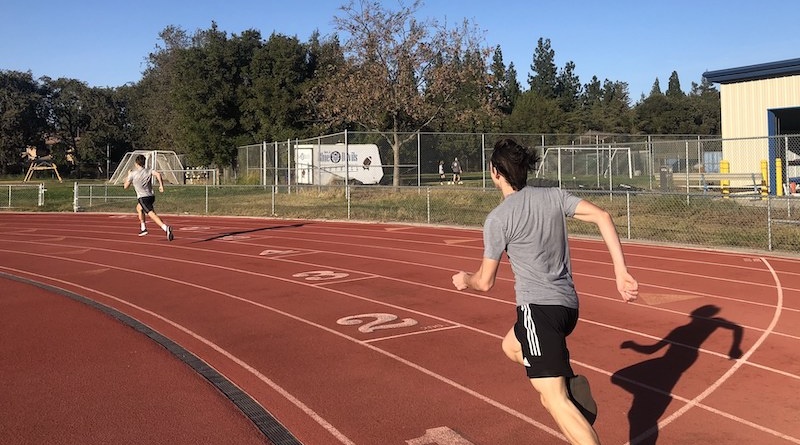 Two high school boys resume track and field practices for the first time since the onset of the pandemic