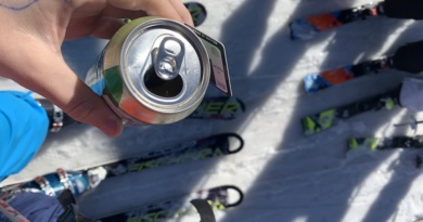 skier holds soda